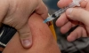 Путин поручил вакцинировать от COVID-19 работающих мигрантов